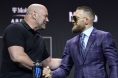 Dana White and Conor McGregor shaking hands