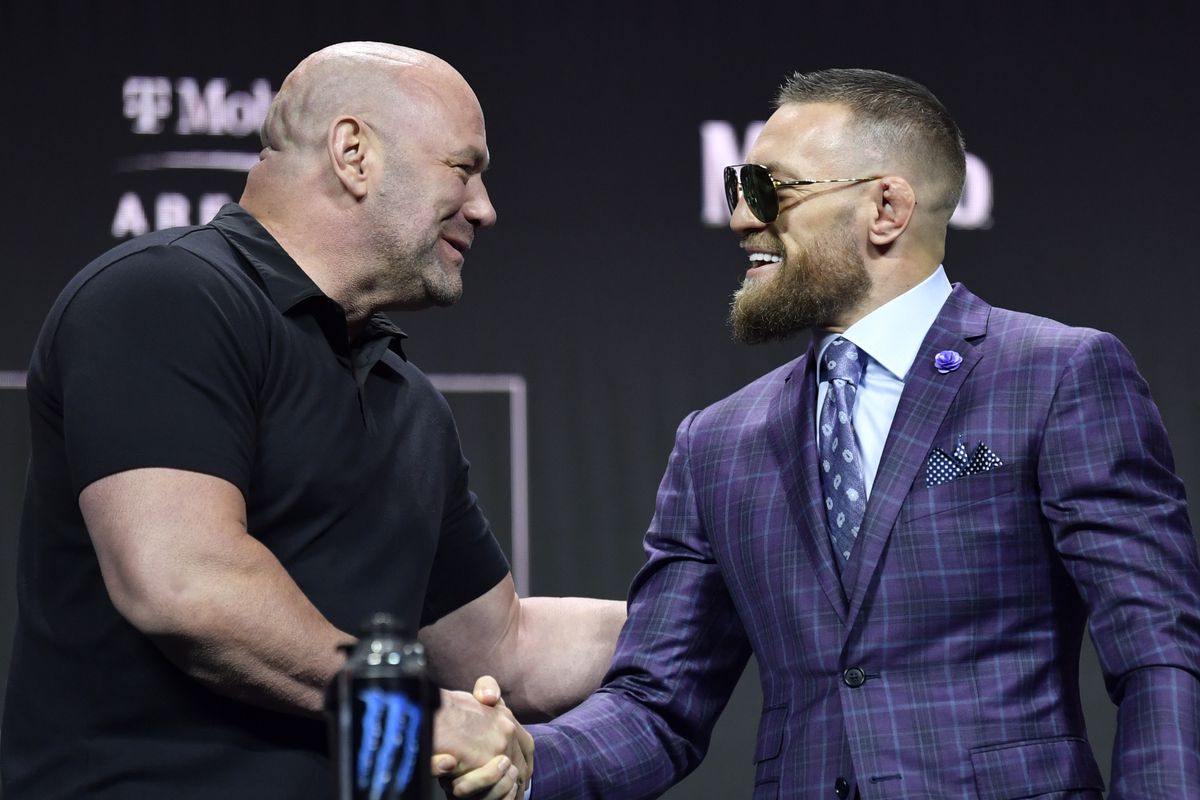 Dana White and Conor McGregor shaking hands