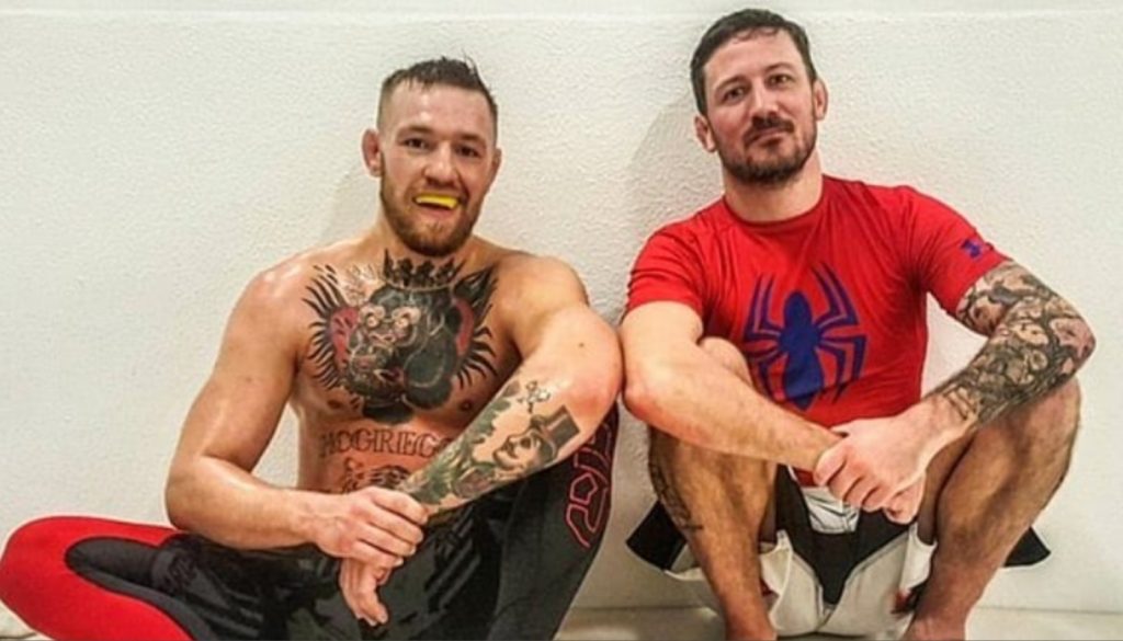 John Kavanagh and Conor McGregor sitting