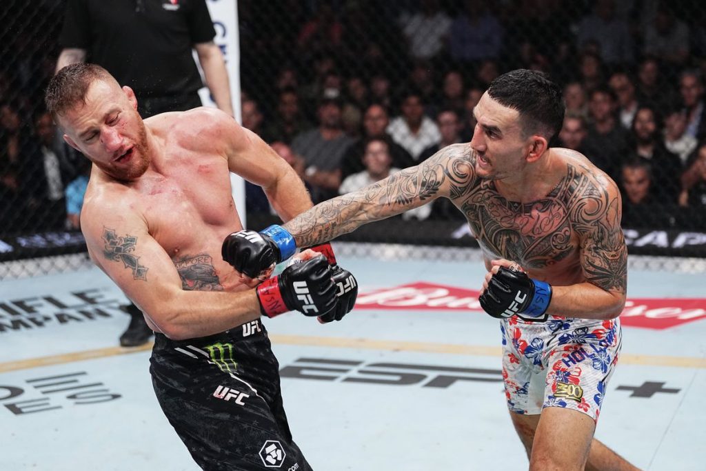 Max Holloway punches Justin Gaethje UFC 300