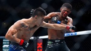 Patchy Mix eats a punch from Mario Bautista at UFC 316