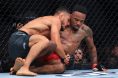 Aaron Pico holds Lerone Murphy at UFC 319
