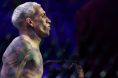 Charles Oliveira enters the Octagon for his fight against Ilia Topuria at UFC 317