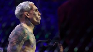 Charles Oliveira enters the Octagon for his fight against Ilia Topuria at UFC 317