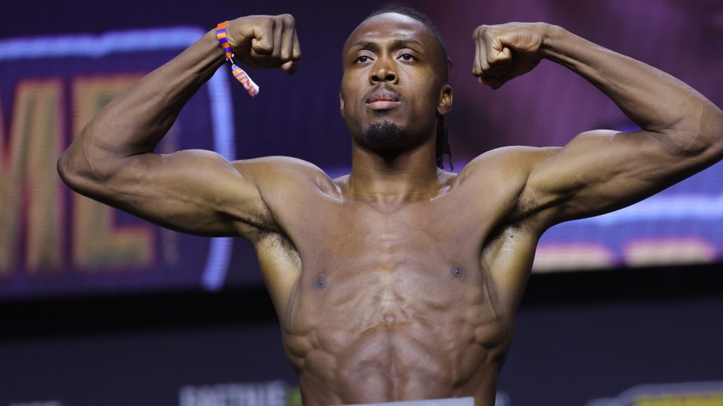 Jalin Turner poses on the scale for his fight against Renato Moicano at UFC 300