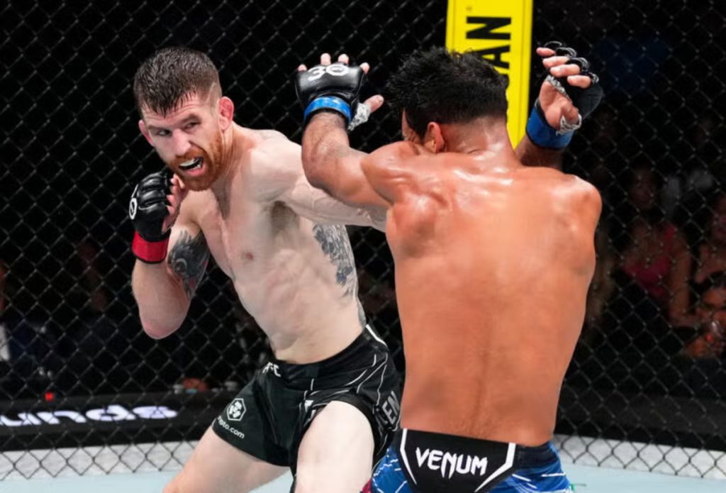 Cory Sandhagen punches Rob Font during UFC fight