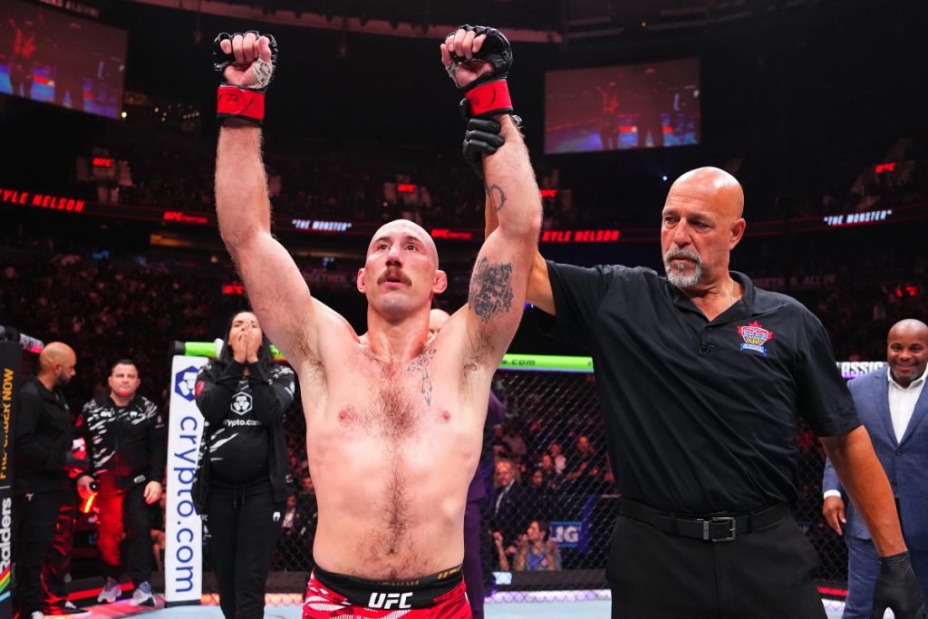 Dan Miragliotta raises Kyle Nelson's arm at UFC Vancouver