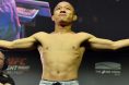 Kyoji Horiguchi poses on the scale during the UFC Belfast ceremonial weigh-in