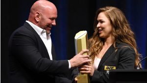 Dana White presents Ronda Rousey with an award at the 2018 UFC Hall of Fame induction ceremony