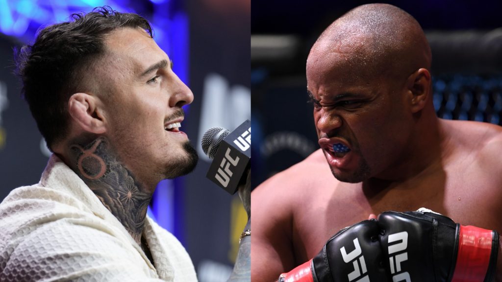 Tom Aspinall speaks at a UFC 304 press conference, opposite Daniel Cormier in the cage at UFC 252