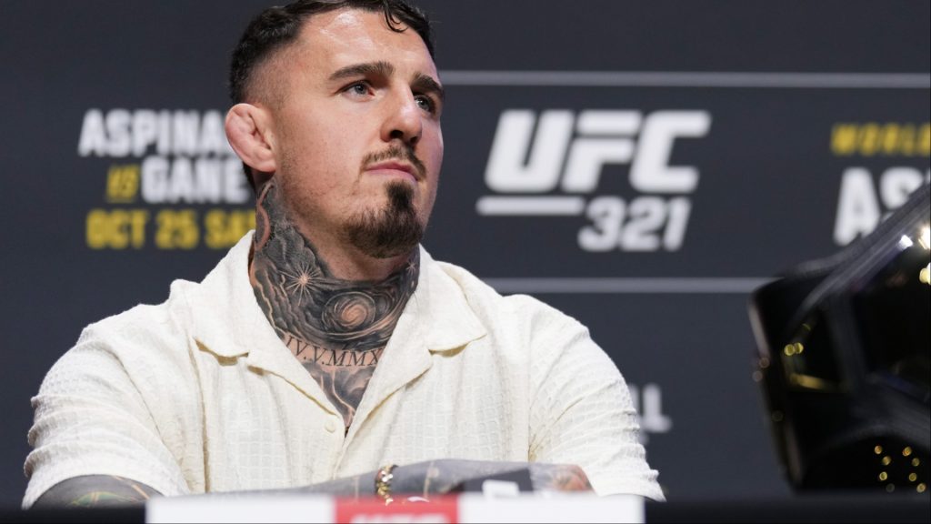 Tom Aspinall appears at a pre-fight press conference for UFC 321
