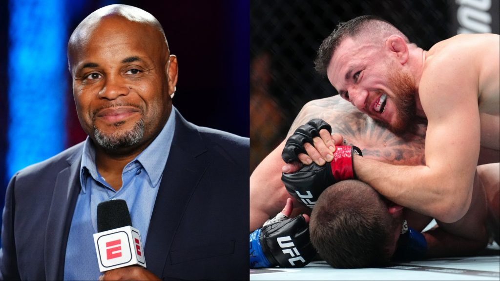 Daniel Cormier commentates at a Dana White's Contender Series event, opposite Merab Dvalishvili grappling Cory Sandhagen at UFC 320