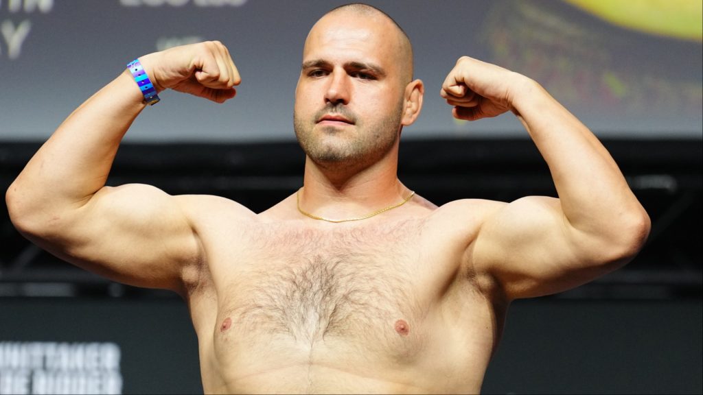 Martin Buday poses on the scale at the UFC Abu Dhabi ceremonial weigh-in