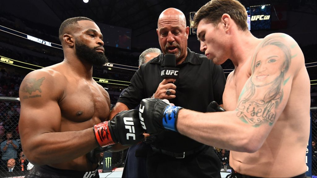 Tyron Woodley and Darren Till touch gloves in the Octagon