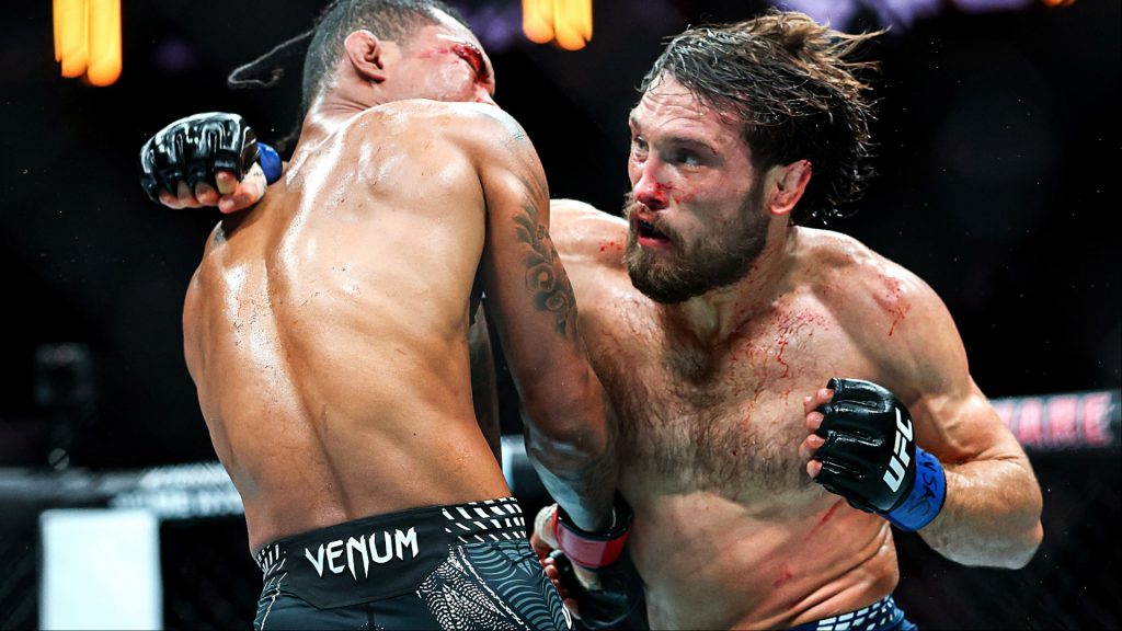 Ethyn Ewing and Malcolm Wellmaker trade punches during their fight at UFC 322