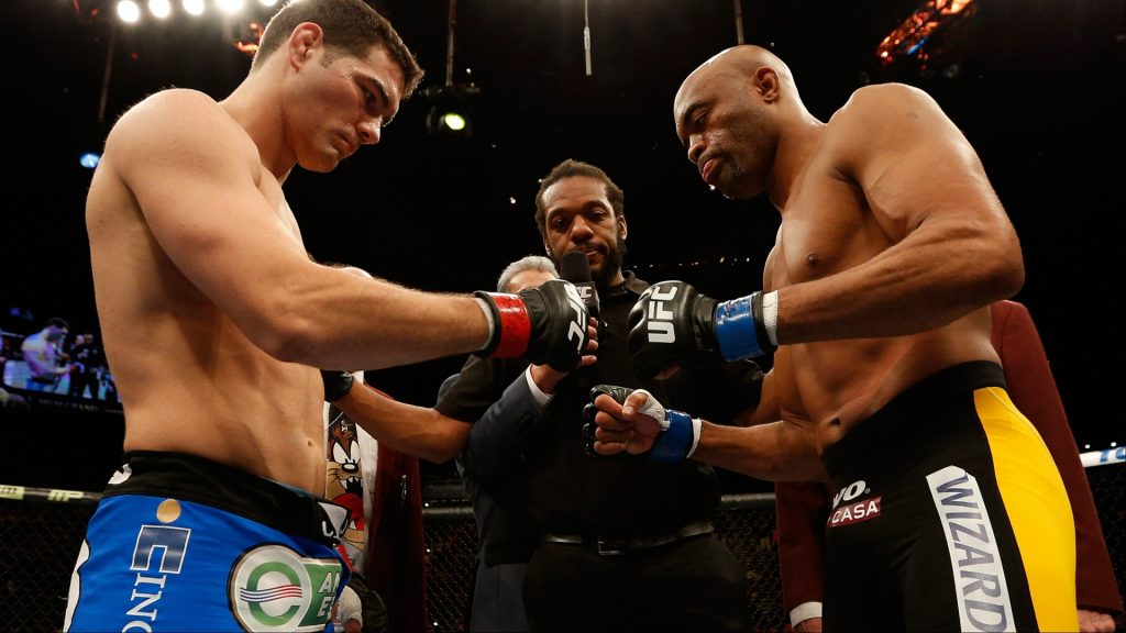 Chris Weidman and Anderson Silva touch gloves ahead of their fight