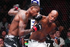 Michael Page punches Kevin Holland