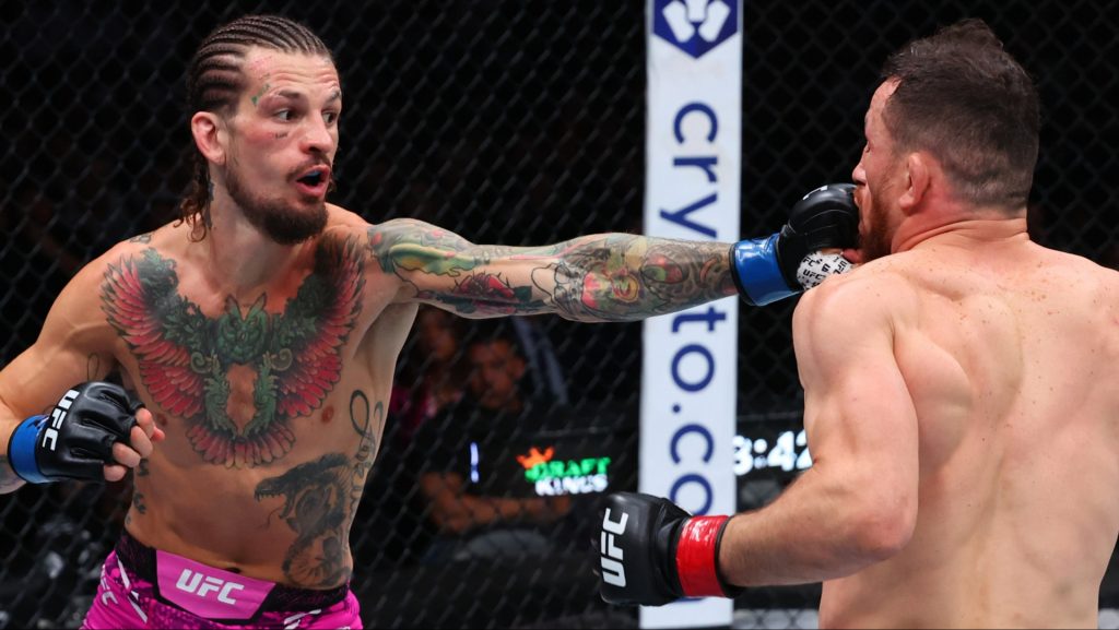 Sean O'Malley punches Merab Dvalishvili during their fight at UFC 316