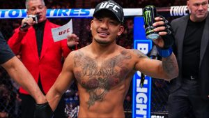 Joshua Van celebrates as the official decision is read at UFC 323