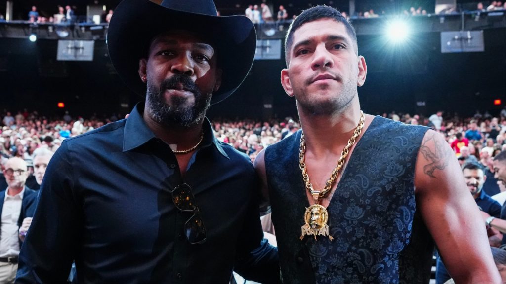 Alex Pereira and Jon Jones pose for a photograph at UFC 306