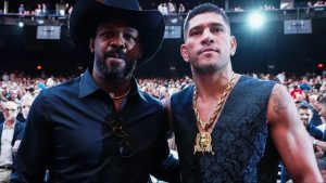 Alex Pereira and Jon Jones pose for a photograph at UFC 306