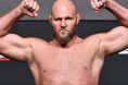 Ben Rothwell poses on the scale during an official UFC weigh-in