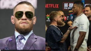 Conor McGregor at the UFC 264 press conference, opposite Jake Paul and Anthony Joshua facing off