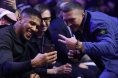 Oleksandr Usyk and Anthony Joshua take a photo ringside at a Riyadh Season event