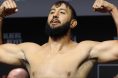 Dominick Reyes poses on the scale during the UFC Perth ceremonial weigh-in