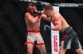 Petr Yan punches Merab Dvalishvili at UFC 323