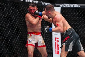 Petr Yan punches Merab Dvalishvili at UFC 323