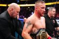 Justin Gaethje gets a UFC belt wrapped around his waist by Dana White at UFC 324