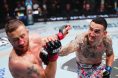 Justin Gaethje punched by Max Holloway at UFC 300