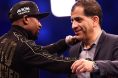 Floyd Mayweather and Showtime executive Stephen Espinoza embrace at a post-fight press conference