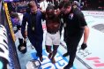 Torrez Finney is helped to his corner at UFC 325