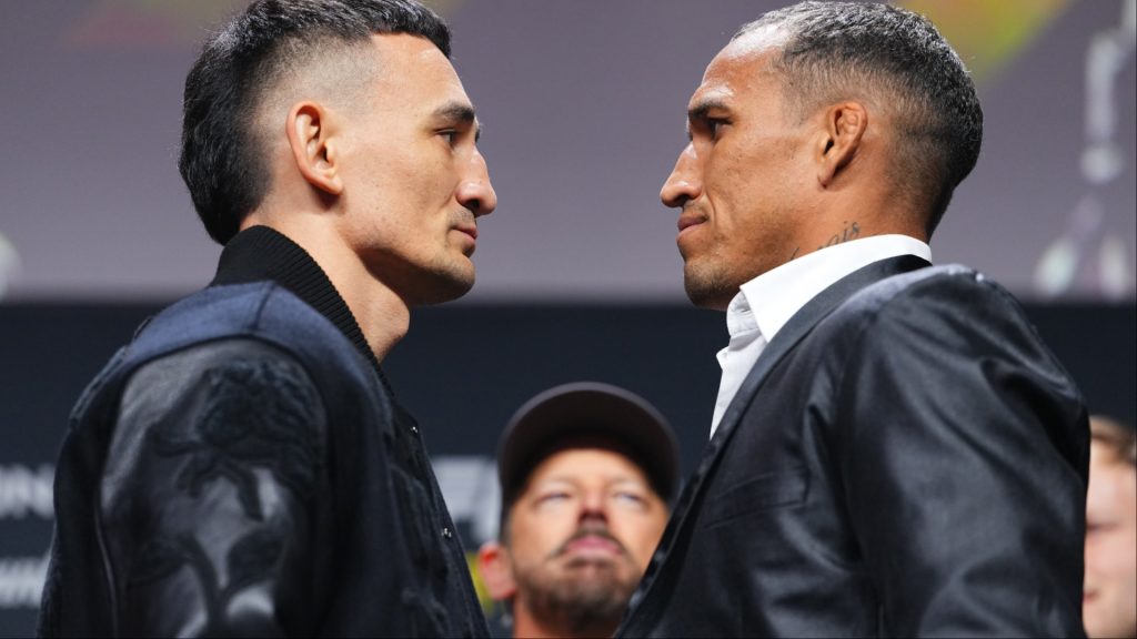 Max Holloway and Charles Oliveira face off at a press conference