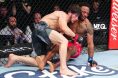 Lerone Murphy taken down by Movsar Evloev at UFC London