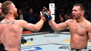 Justin Gaethje and Michael Chandler embrace after their fight at UFC 268