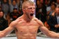 TJ Dillashaw celebrates after defeating Renan Barao for the UFC bantamweight title