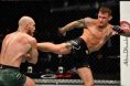 Dustin Poirier kicks Conor McGregor in their UFC 257 bout in Abu Dhabi