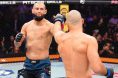 Khamzat Chimaev and Sean Strickland touch gloves at the start of UFC 328 headliner