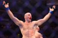 Sean Strickland raises his arms after UFC 328 fight with Khamzat Chimaev