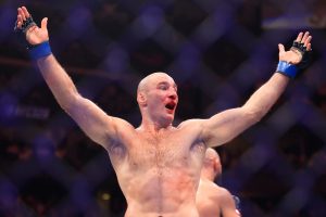 Sean Strickland raises his arms after UFC 328 fight with Khamzat Chimaev