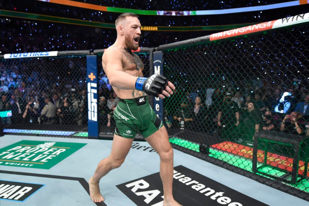 Conor McGregor power walks inside the UFC Octagon