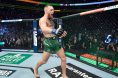 Conor McGregor power walks inside the UFC Octagon