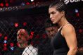 Gina Carano enters the cage for her fight against Ronda Rousey