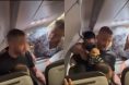 Josh Longood restrains an unruly passenger