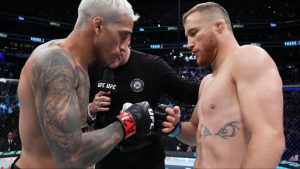 Charles Oliveira and Justin Gaethje touch gloves at UFC 274