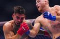 Justin Gaethje punches Ilia Topuria during their fight at UFC Freedom 250