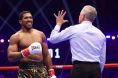 Anthony Joshua gets up after being knocked down by Kristian Prenga